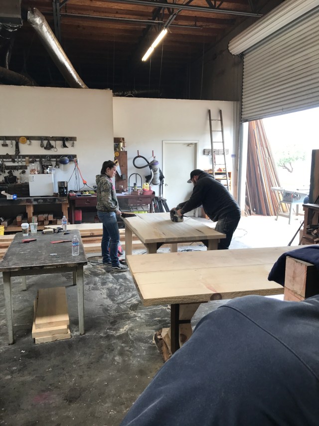 My dad and sister sanding our table.