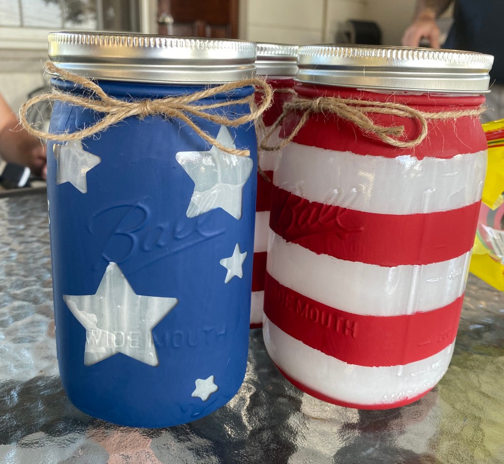 Finished Mason Jars with rims and twine bows. 